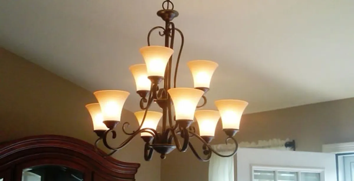Classic ceiling chandelier installation with warm lighting in Cape Coral, FL