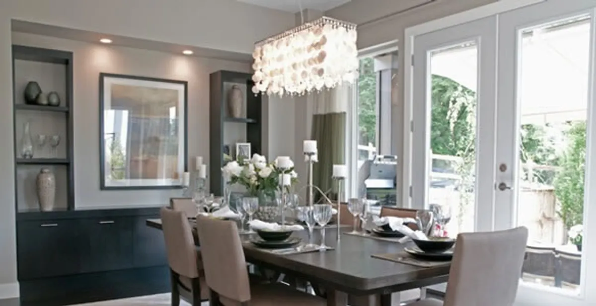 Elegant dining room chandelier installation above table in Cape Coral, FL