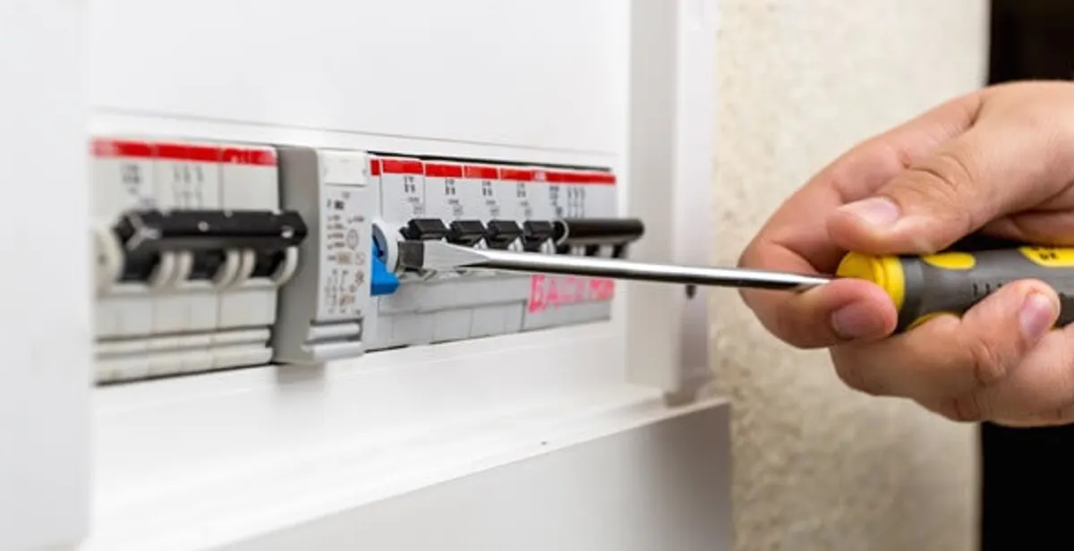 electrical panel upgrade service showing technician adjusting circuit breakers during system upgrade in Cape Coral, FL