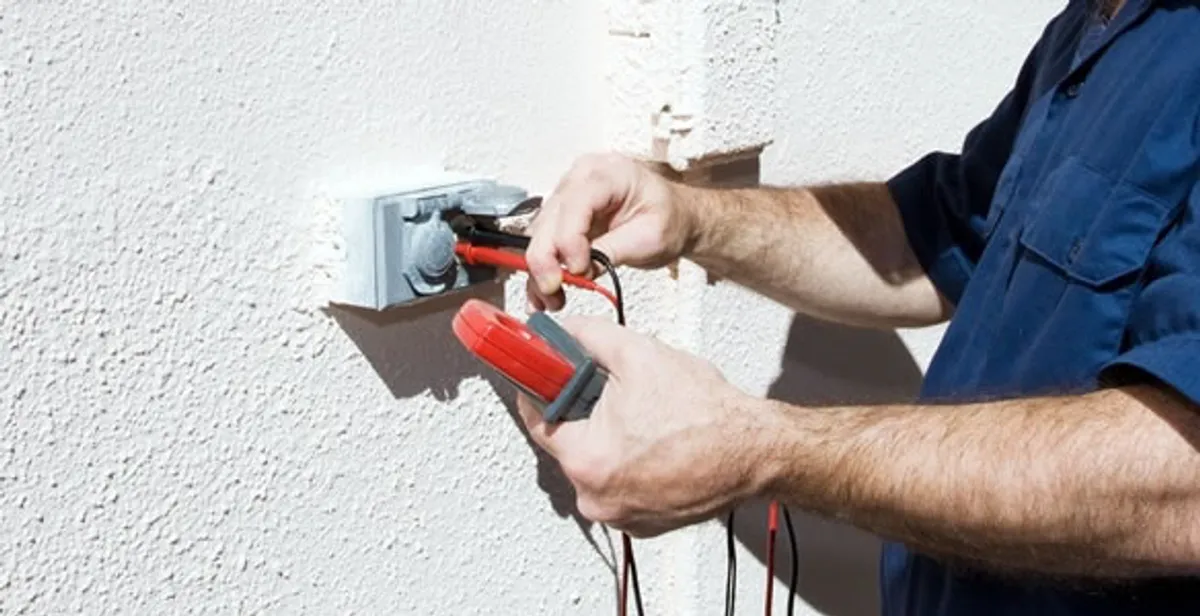 Electrician performing home electrical outlet and wiring inspection in Cape Coral, FL