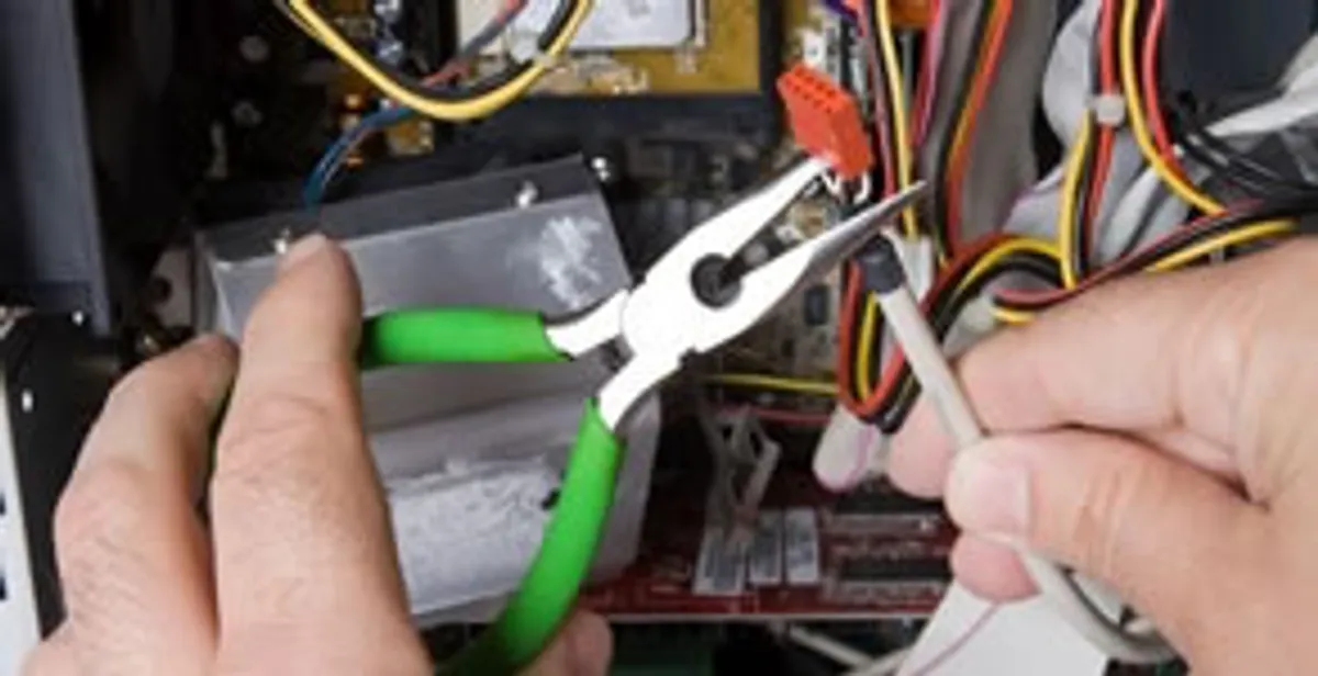 Licensed electrical contractor performing electrical repair with tools in Sanibel, FL