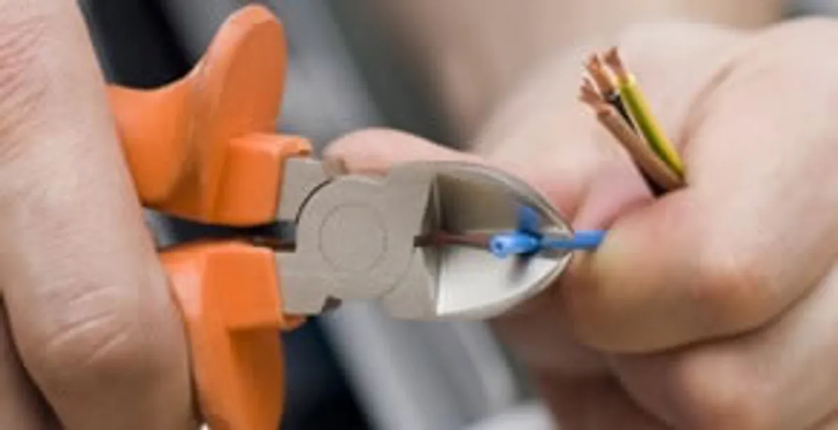 professional electrical services showing precise wire cutting by licensed electricians in Cape Coral, FL
