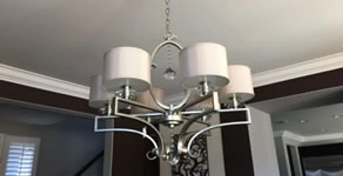 Modern chandelier installation with multiple light fixtures in Cape Coral, FL