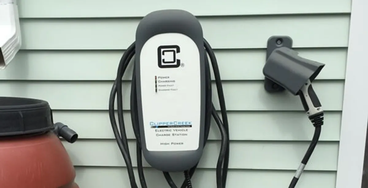 Outdoor electric vehicle charger installation on residential wall in Cape Coral, FL